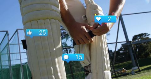 Cricket Player Preparing Pads with Social Media Engagement Icons