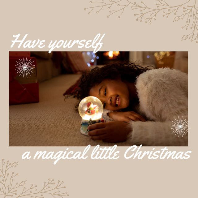 Composition of merry christmas text over african american girl wirh snow globe. Christmas and celebration concept digitally generated image.