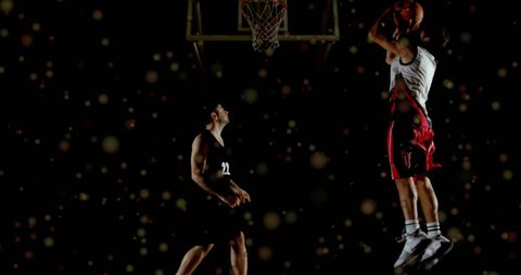 Basketball players in action with digital overlay spots