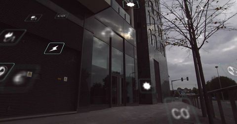 Office glass facade reflecting overcast sky with floating augmented reality icons