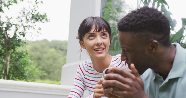 Smiling Woman and Man Having Outdoor Conversation on Porch - Download Free Stock Images Pikwizard.com