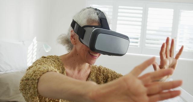 Senior Woman Exploring Virtual Reality with VR Headset - Download Free Stock Images Pikwizard.com