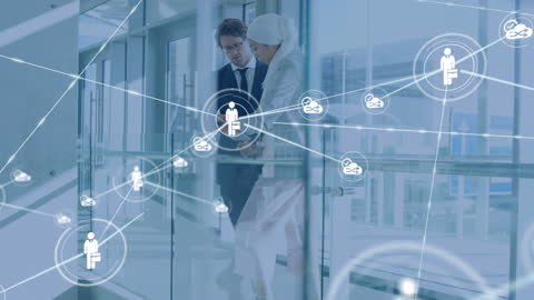 Business Professionals Connecting Through Technology in Modern Office