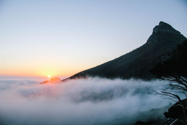 Sunrise Over Misty Mountainside with Rising Fog - Download Free Stock Photos Pikwizard.com