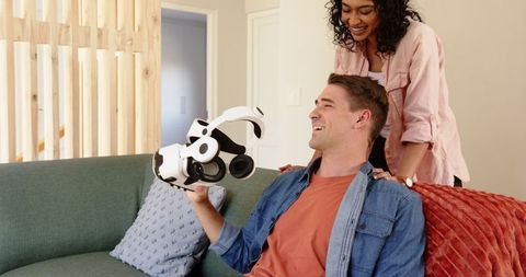 Cheerful Couple Enjoying Virtual Reality Experience at Home