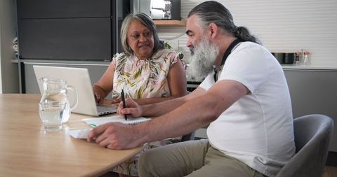 Senior Couple Collaborating on Financial Planning at Home
