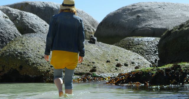 Young Woman Exploring Rocky Beach - Download Free Stock Images Pikwizard.com