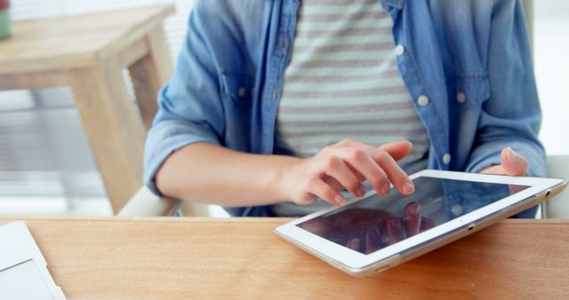 Woman Using Tablet in Casual Office Environment - Download Free Stock Images Pikwizard.com