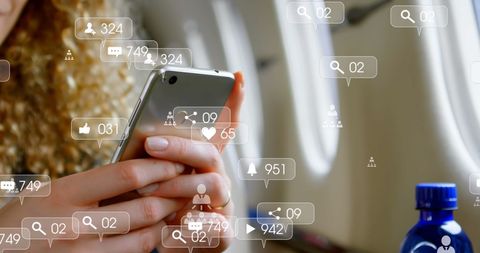 Woman Using Smartphone with Social Media Icons Overlay on Flight