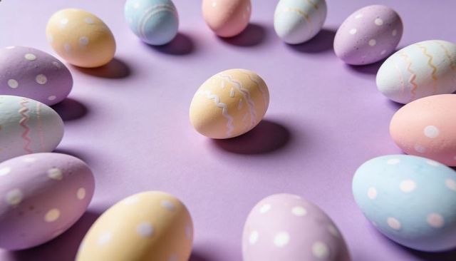 Single Yellow Easter Egg Surrounded by Pastel Polka Dot and Zigzag Eggs on Lavender Backdrop