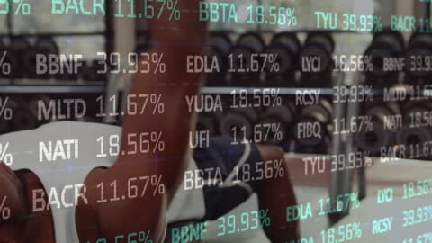 Man Engaging with Technology Amidst Financial Data Visualization