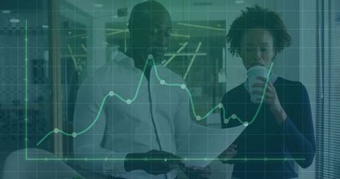 Business professionals reviewing financial data with chart overlay in modern office