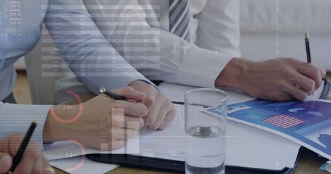 Business Colleagues Analyzing Financial Charts and Data - Download Free Stock Images Pikwizard.com