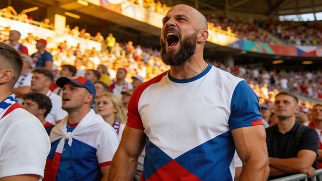 Passionate football fan shouting and cheering in stadium wearing red white blue jersey