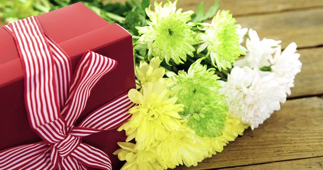 Red Gift Box with White Ribbon and Spring Flowers on Wooden Table - Download Free Stock Images Pikwizard.com