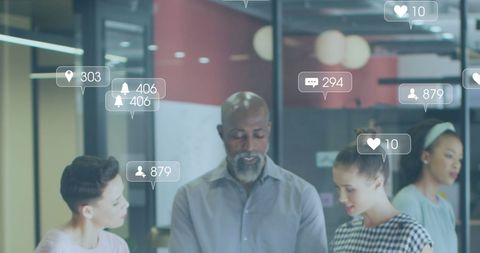 Diverse Team Collaborating with Social Media Icons Everywhere