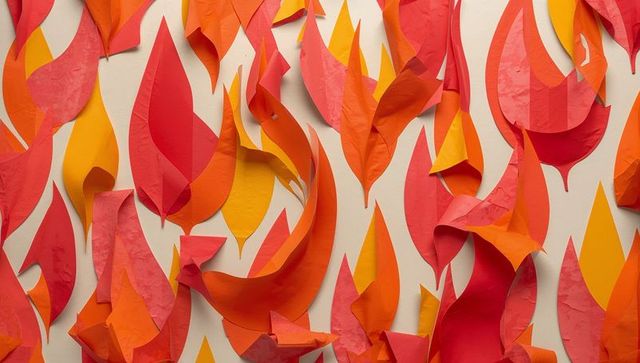 Colorful paper flame art installation over beige background