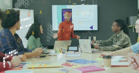 Diverse Team Engaged in Creative Discussion in Modern Office