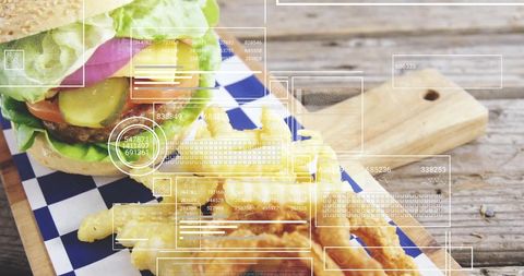 Delicious burger and fries with digital information overlays