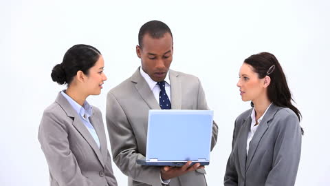 Diverse Business Team Discussing Work with Laptop