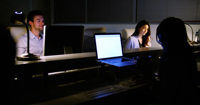 Dedicated Professionals Working Late Night in Office Setting - Download Free Stock Images Pikwizard.com