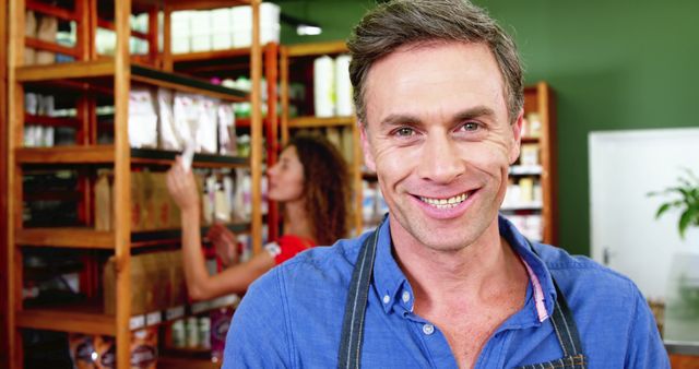 Smiling Male Shopkeeper Inside Organic Grocery Store - Download Free Stock Images Pikwizard.com