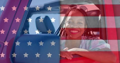 African American Woman Celebrating with USA Flag Overlay in Car
