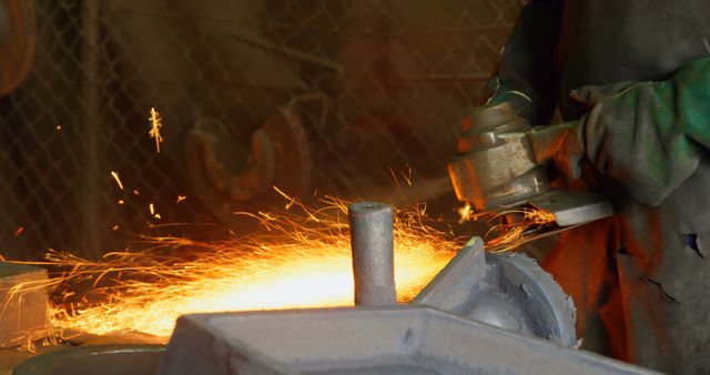 Worker Grinding Metal in Industrial Workshop with Bright Sparks - Download Free Stock Images Pikwizard.com