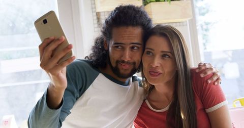 Biracial Couple Taking Selfie Sharing Joy