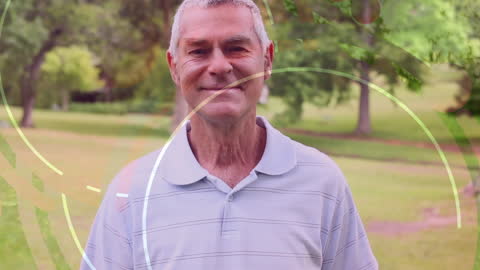 Smiling Elderly Man Enjoying Nature in Park