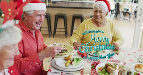 Seniors Enjoying Festive Christmas Meal Together - Download Free Stock Images Pikwizard.com