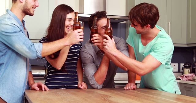 Friends Celebrating in Kitchen with Cheers and Beverages - Download Free Stock Images Pikwizard.com