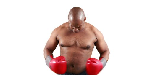Focused Boxer in Training Gloves Exhibiting Determination