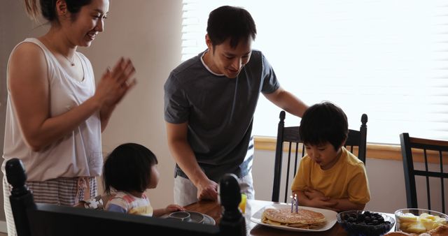 Asian Family Enjoying Breakfast Together at Home Celebrates Warm Family Moments - Download Free Stock Images Pikwizard.com