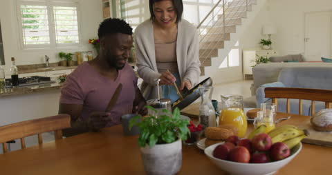Couple Enjoying Homemade Breakfast Together in Light-Filled Kitchen