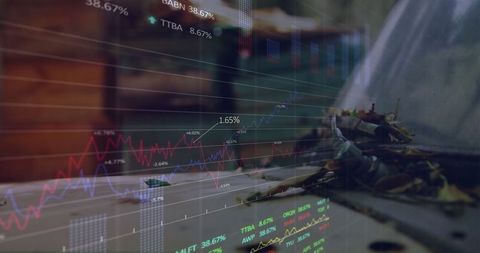 Laptop Keyboard with Financial Overlay and Dried Leaves