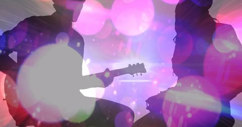 Musical Duo Silhouettes with Vibrant Abstract Lights