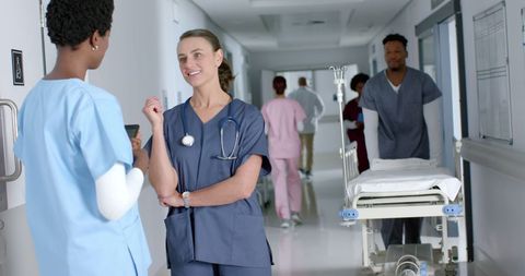 Medical Staff Collaborating in Bustling Hospital Corridor - Download Free Stock Images Pikwizard.com
