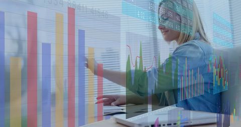 businesswoman analyzing data on laptop with statistics overlay - Download Free Stock Images Pikwizard.com