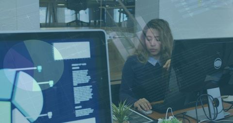 Businesswoman Analyzing Data on Computer with Graphs Overlay - Download Free Stock Images Pikwizard.com