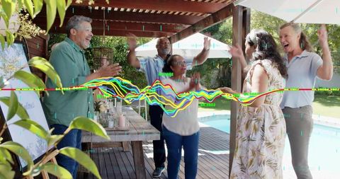 Multigenerational friends celebrating on sunny backyard deck by pool with colorful waveform