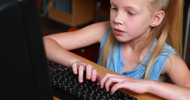 Focused Girl Using Computer in Classroom Setting - Download Free Stock Images Pikwizard.com