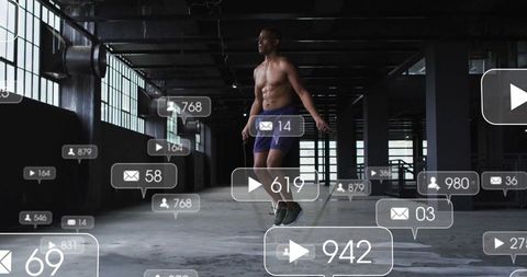 Shirtless Man Jump Roping in Industrial Gym with Social Media Elements