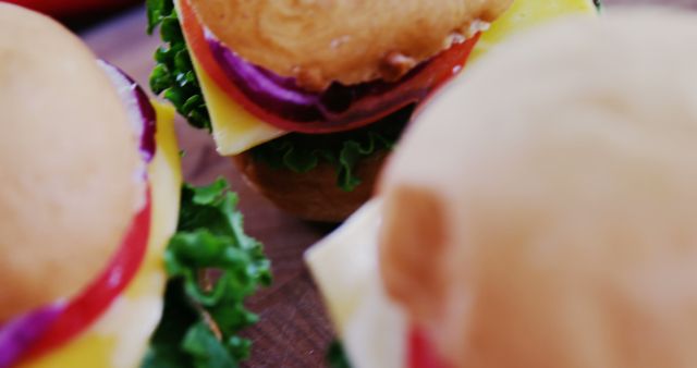 Close-up View of Fresh Homemade Cheeseburgers with Vegetables - Download Free Stock Images Pikwizard.com