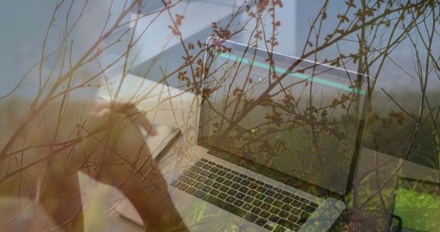 Concentrating woman working on laptop with natural overlay artistic concept