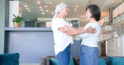 Senior Diverse Women Embracing Friendship at Home