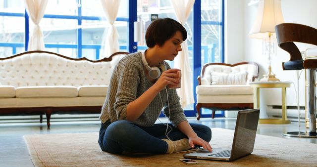 Young Woman Working from Home on Laptop with Headphones and Coffee - Download Free Stock Images Pikwizard.com