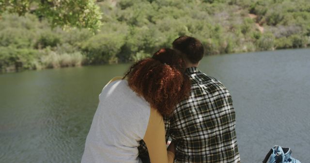 Couple Comparting Intimate Moment by Scenic Lake Amid Lush Greenery - Download Free Stock Images Pikwizard.com