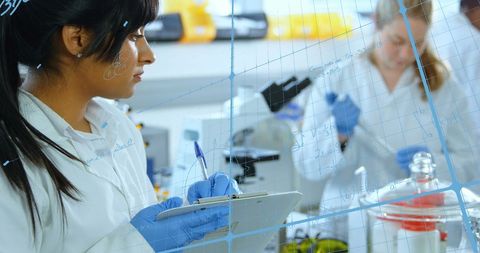 Scientists Collaborating with High-Tech Data Overlay in Laboratory - Download Free Stock Images Pikwizard.com