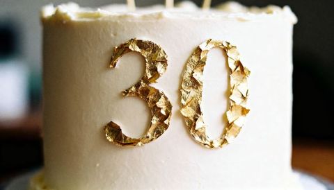 Gold foil 30 cake on white buttercream celebrating 30th birthday milestone